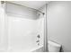 Bathroom featuring a white shower/tub and toilet at 11222 Boston Way, Fishers, IN 46038