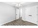 Neutral bedroom with ceiling fan, wood floors and a double door closet at 11222 Boston Way, Fishers, IN 46038