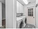 Laundry room featuring a washer and dryer and stylish floor tiles at 11222 Boston Way, Fishers, IN 46038