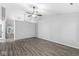 Spacious living room with wood-look floors, shiplap accent wall, and neutral paint at 11222 Boston Way, Fishers, IN 46038