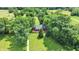 Aerial view of a home surrounded by a beautiful, tree-filled landscape and grassy lawn at 1155 Cope Rd, Martinsville, IN 46151