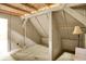 Light and airy attic room with dormer ceilings, neutral walls, and a convenient closet space at 1155 Cope Rd, Martinsville, IN 46151