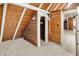 A charming attic room featuring wood-paneled walls, vaulted ceilings, and a cozy closet space at 1155 Cope Rd, Martinsville, IN 46151