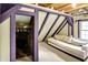 Relaxing attic room with exposed beams and painted trim offers an inviting seating area and closet at 1155 Cope Rd, Martinsville, IN 46151