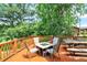 Outdoor deck featuring a built-in fire pit with seating and a picnic table, perfect for entertaining at 1155 Cope Rd, Martinsville, IN 46151