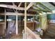 Rustic barn interior featuring wooden stalls, weathered beams, and natural light, perfect for a hobby farm at 1155 Cope Rd, Martinsville, IN 46151