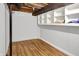 Unfinished basement with wood-look flooring, bright and awaiting customization at 1155 Cope Rd, Martinsville, IN 46151