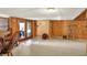 Finished basement with a walkout, carpeted floors and wood paneled walls, great for storage and entertainment at 1155 Cope Rd, Martinsville, IN 46151
