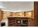Finished basement with a wood bar, carpeted flooring, paneled walls and retro details at 1155 Cope Rd, Martinsville, IN 46151