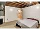 Basement bedroom with carpet floors, paneled walls, and an exposed ceiling creating a cozy retreat at 1155 Cope Rd, Martinsville, IN 46151