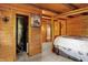 Bedroom includes all-wood walls, closet, and a bed with decorative bedding at 1155 Cope Rd, Martinsville, IN 46151