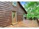 Wooden deck featuring an exterior door with decorative oval window at 1155 Cope Rd, Martinsville, IN 46151
