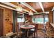 Warm dining area with views of the outdoors, wood accents, and comfortable seating at 1155 Cope Rd, Martinsville, IN 46151