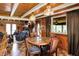 Charming dining area featuring wood-paneled walls, hardwood floors, and a cozy atmosphere at 1155 Cope Rd, Martinsville, IN 46151