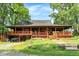 Charming home with a large porch, mature trees, and a welcoming entrance at 1155 Cope Rd, Martinsville, IN 46151