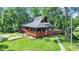 Beautiful cabin-style home with a large wrap-around porch and stunning wooded surroundings at 1155 Cope Rd, Martinsville, IN 46151