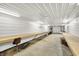 Spacious garage features a long workbench, ample lighting, and plenty of room for projects or storage at 1155 Cope Rd, Martinsville, IN 46151