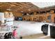 Large garage area with plywood walls, storage and space for equipment and vehicles at 1155 Cope Rd, Martinsville, IN 46151
