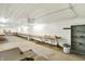 Spacious garage/workshop area with concrete floor, shelving and overhead lighting at 1155 Cope Rd, Martinsville, IN 46151