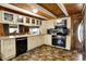 Modern kitchen features white cabinetry, stainless steel appliances, and an eat-in bar area at 1155 Cope Rd, Martinsville, IN 46151