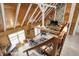 High angle view of living room showcases vaulted ceilings, wood beams, and stone fireplace at 1155 Cope Rd, Martinsville, IN 46151