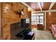 This bedroom offers a cozy retreat with a TV, natural light and wood-paneled walls at 1155 Cope Rd, Martinsville, IN 46151