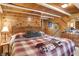 Comfortable bedroom boasting wood walls, and warm natural lighting at 1155 Cope Rd, Martinsville, IN 46151