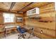 Functional office space with modern desk, natural light, and wood-paneled walls at 1155 Cope Rd, Martinsville, IN 46151