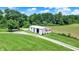 Aerial view of an outbuilding with signage, situated on a well-maintained lawn at 1155 Cope Rd, Martinsville, IN 46151