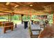 Large covered outdoor patio with seating, tables, and bar area, perfect for entertaining and enjoying the outdoors at 1155 Cope Rd, Martinsville, IN 46151
