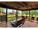 Spacious porch with various seating options, overlooking a scenic outdoor area at 1155 Cope Rd, Martinsville, IN 46151
