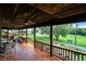 Expansive wooden porch with outdoor seating and a view of the surrounding landscape at 1155 Cope Rd, Martinsville, IN 46151