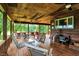 Wide-covered porch with ceiling fans and swing chairs, perfect for relaxing at 1155 Cope Rd, Martinsville, IN 46151