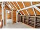 Upper hallway features built in shelving, vaulted ceilings, and natural light at 1155 Cope Rd, Martinsville, IN 46151