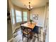 Inviting dining room with wood table, stylish chairs, and natural light from bay windows at 1173 Carlton Ct, Greenwood, IN 46143