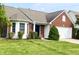 Attractive brick and siding home with a well-kept lawn and landscaping at 1173 Carlton Ct, Greenwood, IN 46143