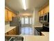Open kitchen view with stainless appliances and a pass-through to the dining area at 1173 Carlton Ct, Greenwood, IN 46143