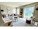 Sunlit living room with stylish decor, comfortable seating, and a view of the backyard at 1173 Carlton Ct, Greenwood, IN 46143