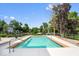 Inground pool with a basketball hoop and lake views provides ample space for outdoor fun at 12208 Island Dr, Indianapolis, IN 46256