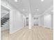 Finished basement features recessed lighting, wood floors, and stairway access at 12208 Island Dr, Indianapolis, IN 46256