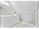 Bathroom with a white vanity, gray walls, and a mosaic tiled floor at 12208 Island Dr, Indianapolis, IN 46256