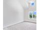 Bedroom featuring carpet, white walls, and a window overlooking the trees and river at 12208 Island Dr, Indianapolis, IN 46256