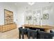 Inviting dining room featuring a wooden table, sleek modern chairs, and stylish built-in storage at 12208 Island Dr, Indianapolis, IN 46256