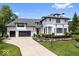 Stately home with manicured front yard, two-car garage, and classic architectural details at 12208 Island Dr, Indianapolis, IN 46256