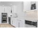 Modern kitchen with stainless appliances, subway tile backsplash, and ample cabinet space at 12208 Island Dr, Indianapolis, IN 46256