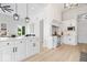 Spacious kitchen with white cabinets, a large island, stainless steel appliances, and modern pendant lights at 12208 Island Dr, Indianapolis, IN 46256