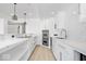 Modern kitchen featuring stainless steel appliances, white subway tile, and quartz countertops at 12208 Island Dr, Indianapolis, IN 46256