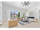 Bright living room with expansive windows and modern fireplace at 12208 Island Dr, Indianapolis, IN 46256