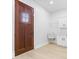 Mud room featuring a wood door and a utility sink with white cabinetry at 12208 Island Dr, Indianapolis, IN 46256