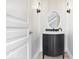 Modern powder room with updated vanity, lighting and decorative mirror at 12208 Island Dr, Indianapolis, IN 46256